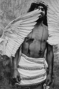 Person with angel wings and a textured wall background